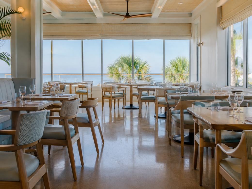 A restaurant dining room cleaned and reset before service