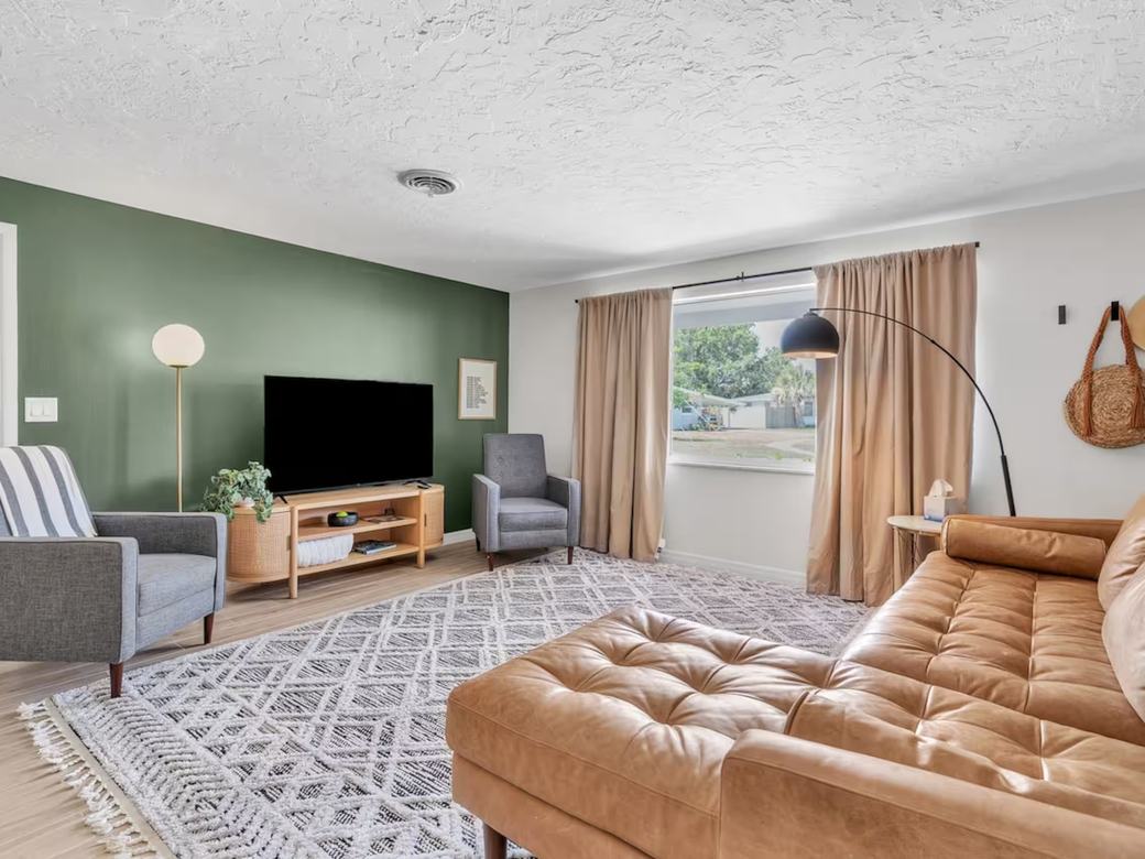 A clean, bright living room in a Sarasota home on recurring service